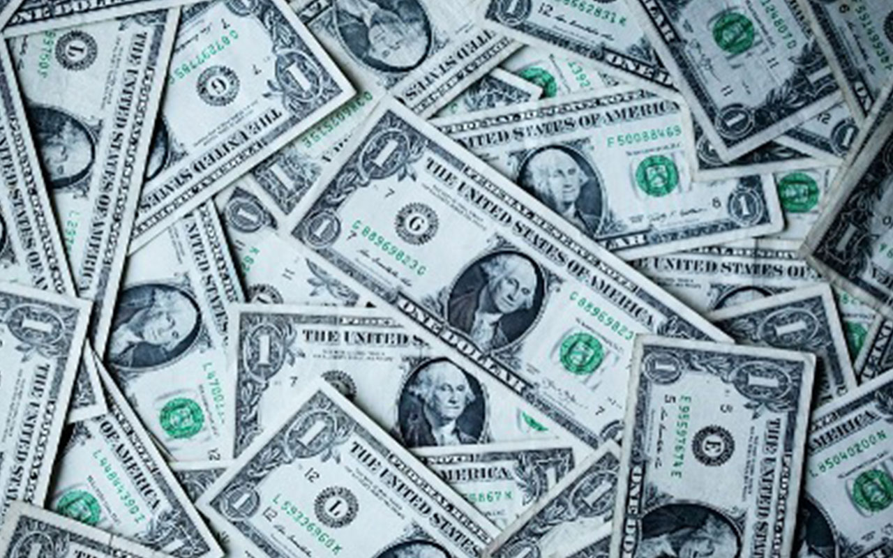 One dollar bills spread out.