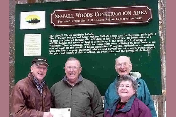 Group by Sewall Woods sign