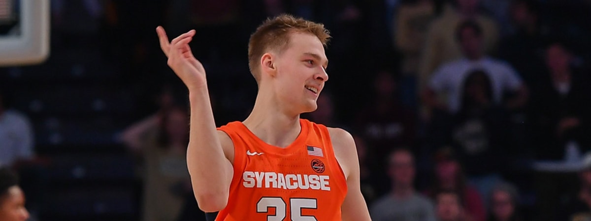 Syracuse forward Benny Williams, right, grabs a rebound in front