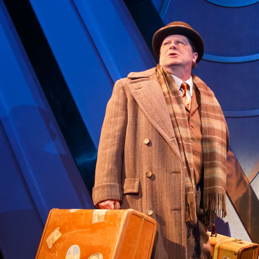 Michael McGrath and Mark Linn-Baker in coats and briefcases during ON THE TWENTIETH CENTURY.