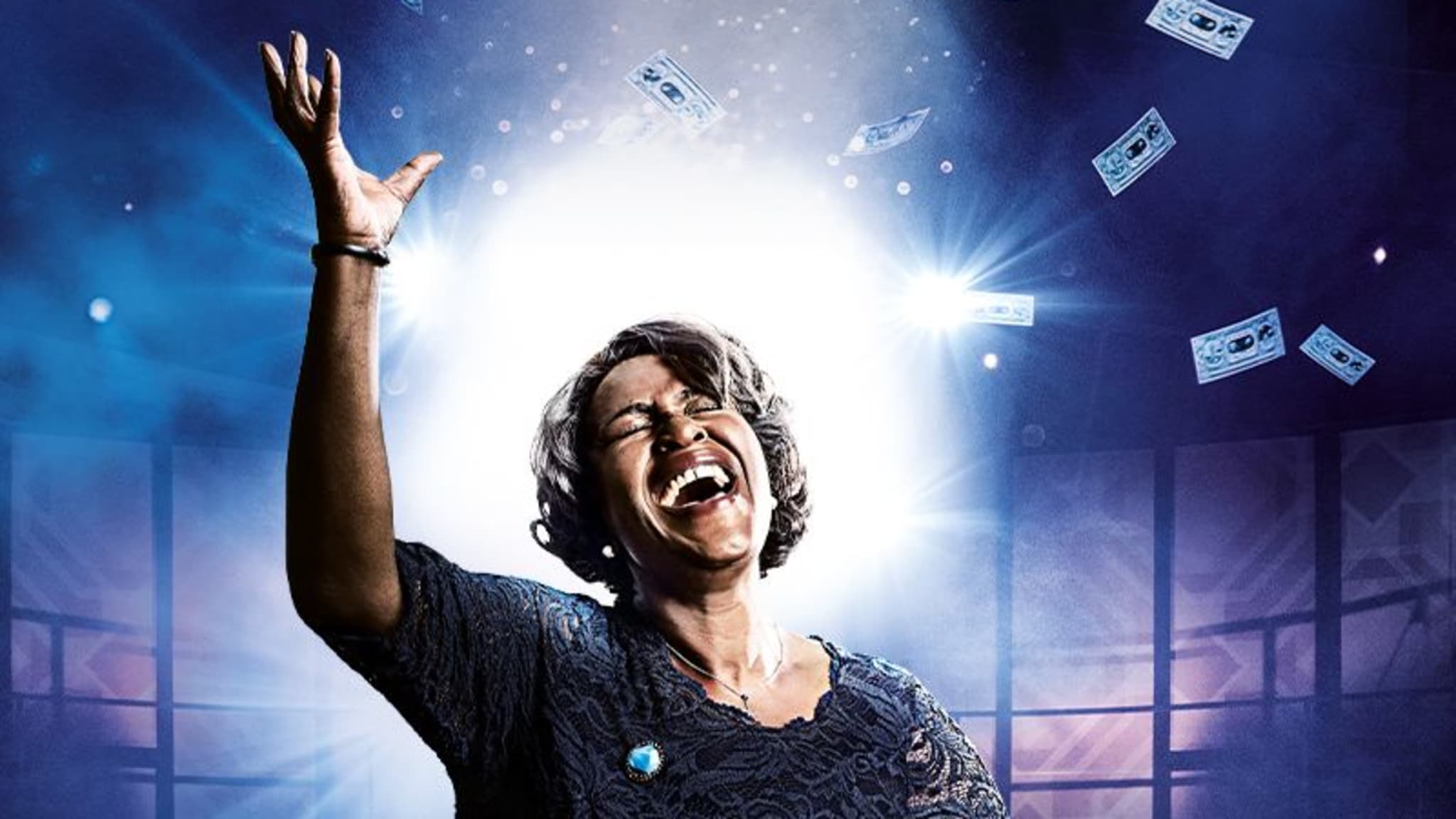 Artwork for Caroline, Or Change. An image of Sharon D Clarke passionately singing in front of a glowing, sparkling blue background.