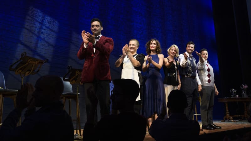 The Cast of Fallen Angels clapping on stage. 