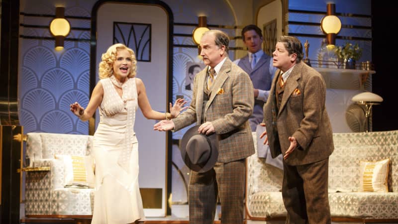 Michael McGrath and Mark Linn-Baker look at a singing Kristen Chenoweth with arms out in desparation.