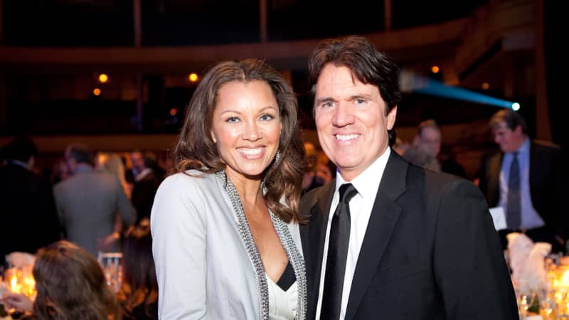 Vanessa Williams and Rob Marshall pose together for a photo in a ballroom.