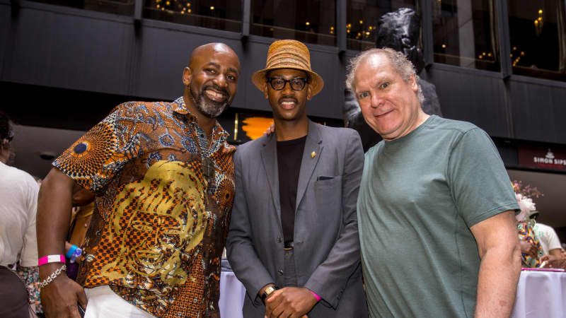 Eric Berryman and Jay O. Sanders pose for a photo with a theatregoer.