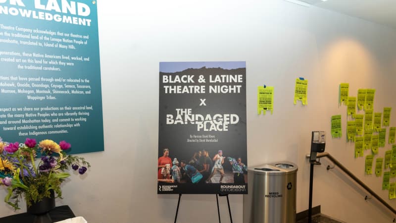 A poster on an easel that says Black & Latine Theatre Night X The Bandaged Place.