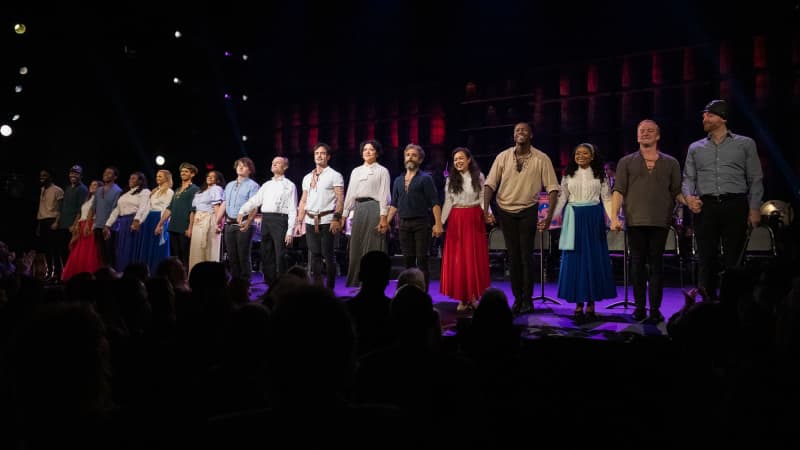 The cast of PIRATES OF PENZANCE holds hands and lines up at the front of the stage at curtain call.