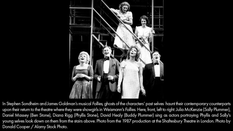 Two middle-aged, formally dressed couples sing as two younger women in 1940s dresses look down at them from a set of stairs