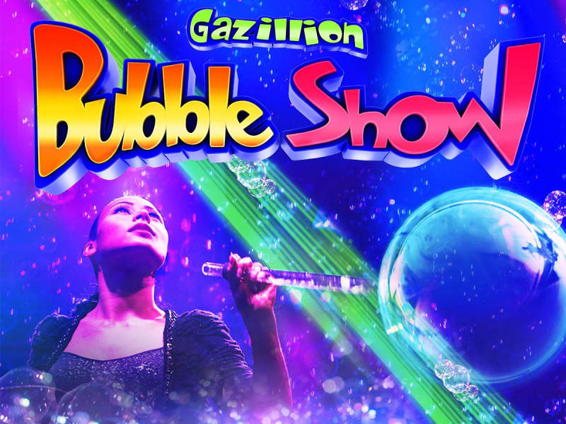 Gazillion Bubble Show. Colorful graphic of a woman among multicolored bubbles.