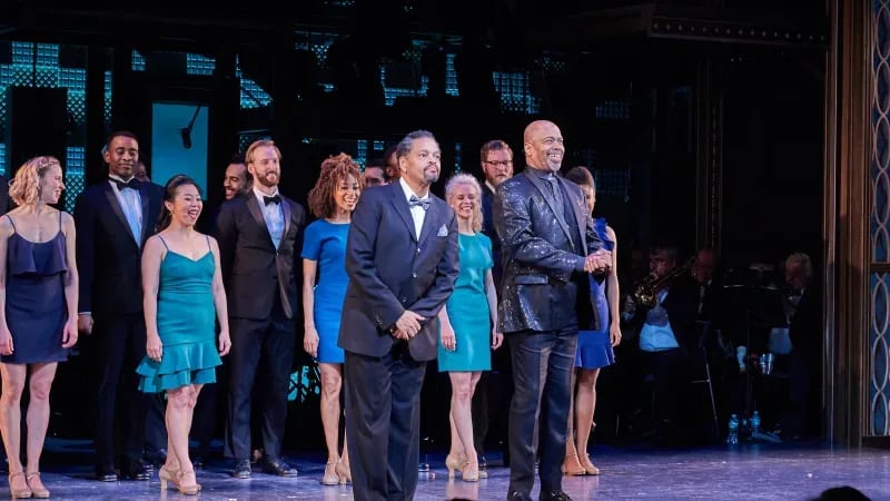 The cast of MY ONE AND ONLY at curtain call. Two men take their bow.