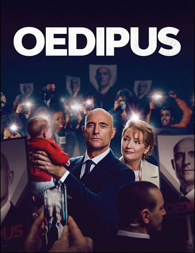 Mark Strong and Lesley Manville in a scene from Oedipus, surrounded by a crowd holding campaign-style posters.


