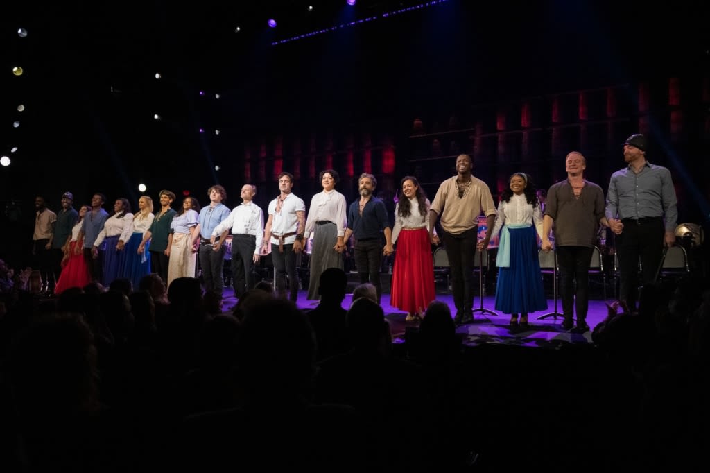 The cast of PIRATES OF PENZANCE holds hands and lines up at the front of the stage at curtain call. Photo by Marcus Middleton.