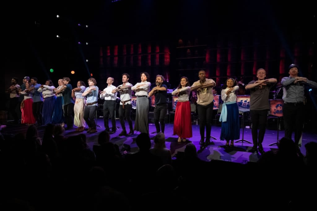 The cast of PIRATES OF PENZANCE dances in a line at the front of the stage. Photo by Marcus Middleton.