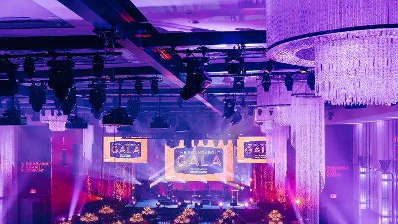 Ballroom lit up in purple tones.