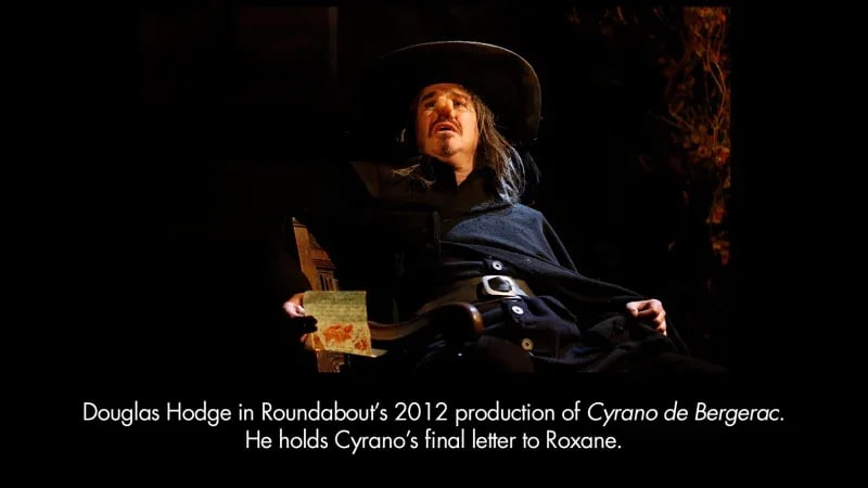Douglas Hodge in Roundabout's 2012 production of Cyrano de Bergerac. He holds Cyrano's final letter to Roxane.