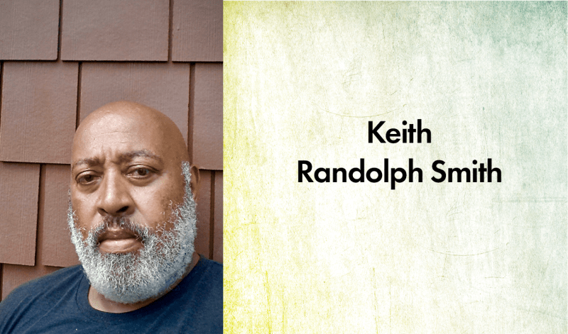 Keith Randolph Smith. A dark-skinned man with a full, graying beard wearing a dark blue shirt.