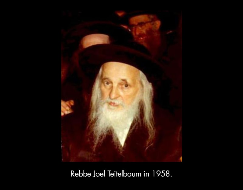 Rebbe Joel Teitelbaum in 1958. An older, light-skinned man with a long white beard and sidelocks wearing a black hat. 