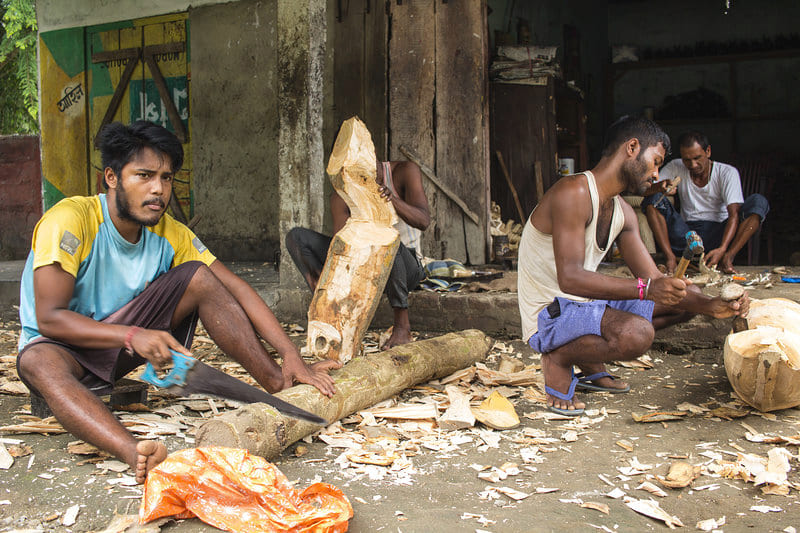 The woodcarving workshop run by Anup and Khajan at Rajabari, Kaziranga. Now in their late 20s, the men have been in the business for 15 years. 
Photo: Sumit Das
