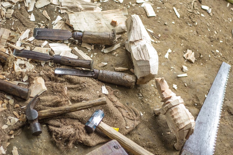 The tools of a woodcarver: chisels, gouges, hammers and a hacksaw. Photo: Sumit Das
