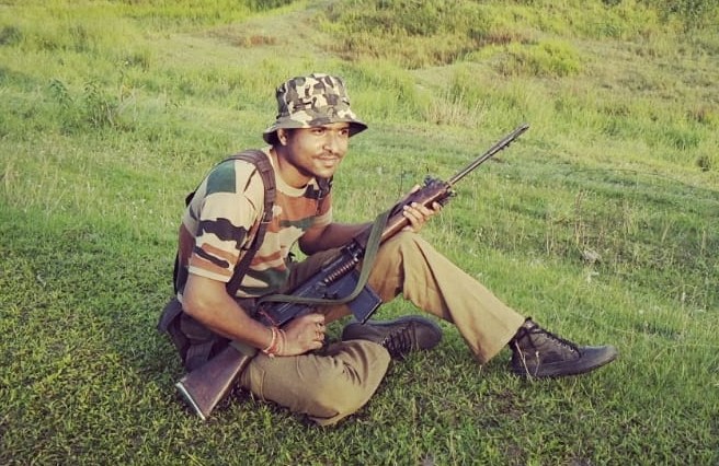 Lakhyajit Saikia from the Assam Forest Protection Force is armed, alert and ready to nab any poacher in Kaziranga’s Biswanath Wildlife Division. Photo: Assam Forest Department (KNP)
