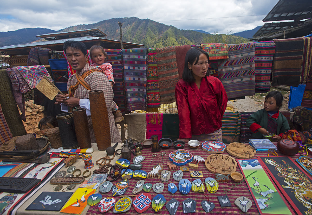 Stalls at the festival in Phobjikha brim with colourful paraphernalia: painted stones, scarves, scrolls, shawls, prayer beads, and embroidered patches, all featuring the crane. Hundreds of Bhutanese travel great distances to attend the event. Among the more popular events are the masked dance performances by resident monks. 