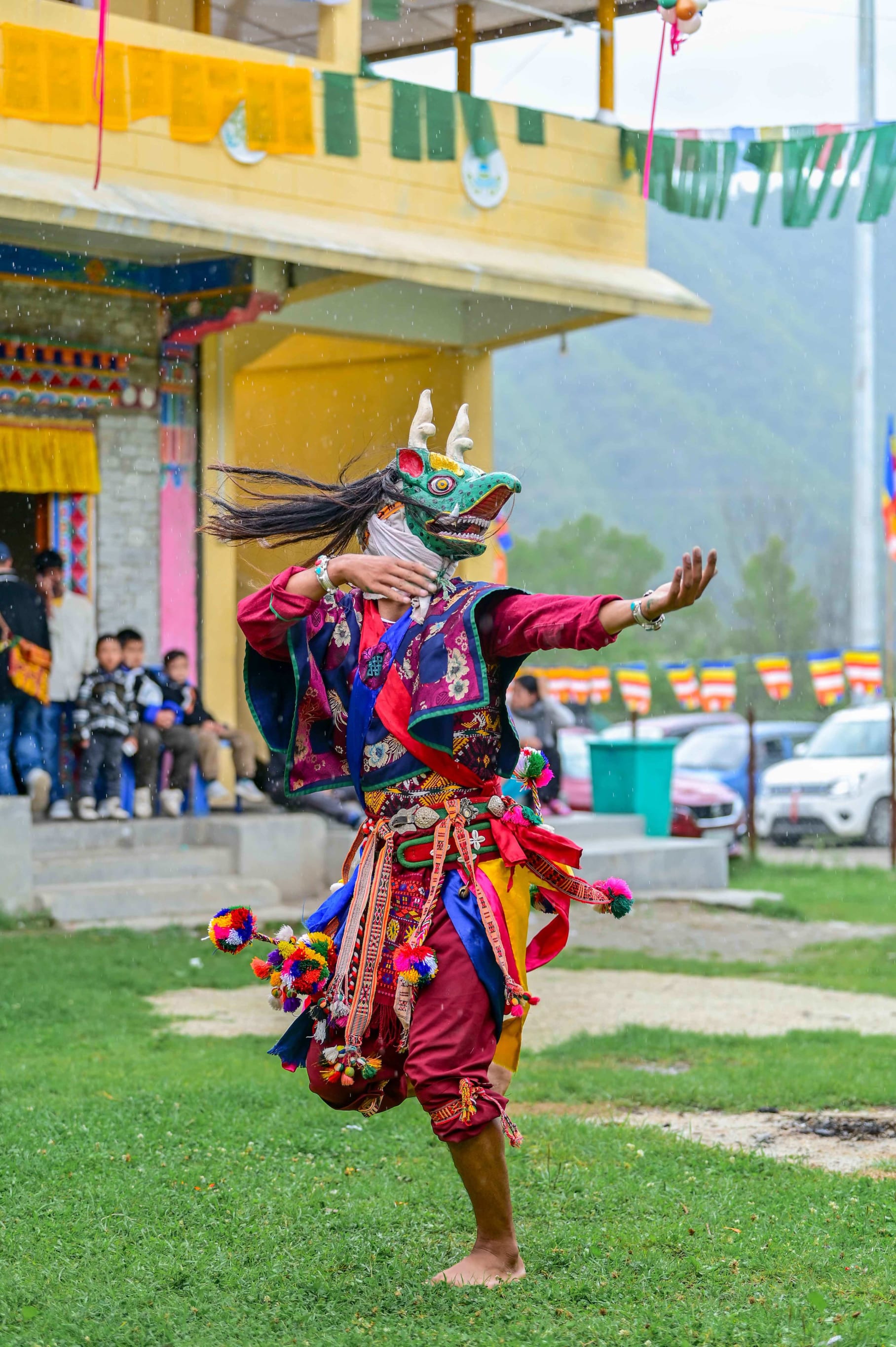 A masked dancer of Bardo Cham in Shergaon, Arunachal, in colourful, traditional attire.