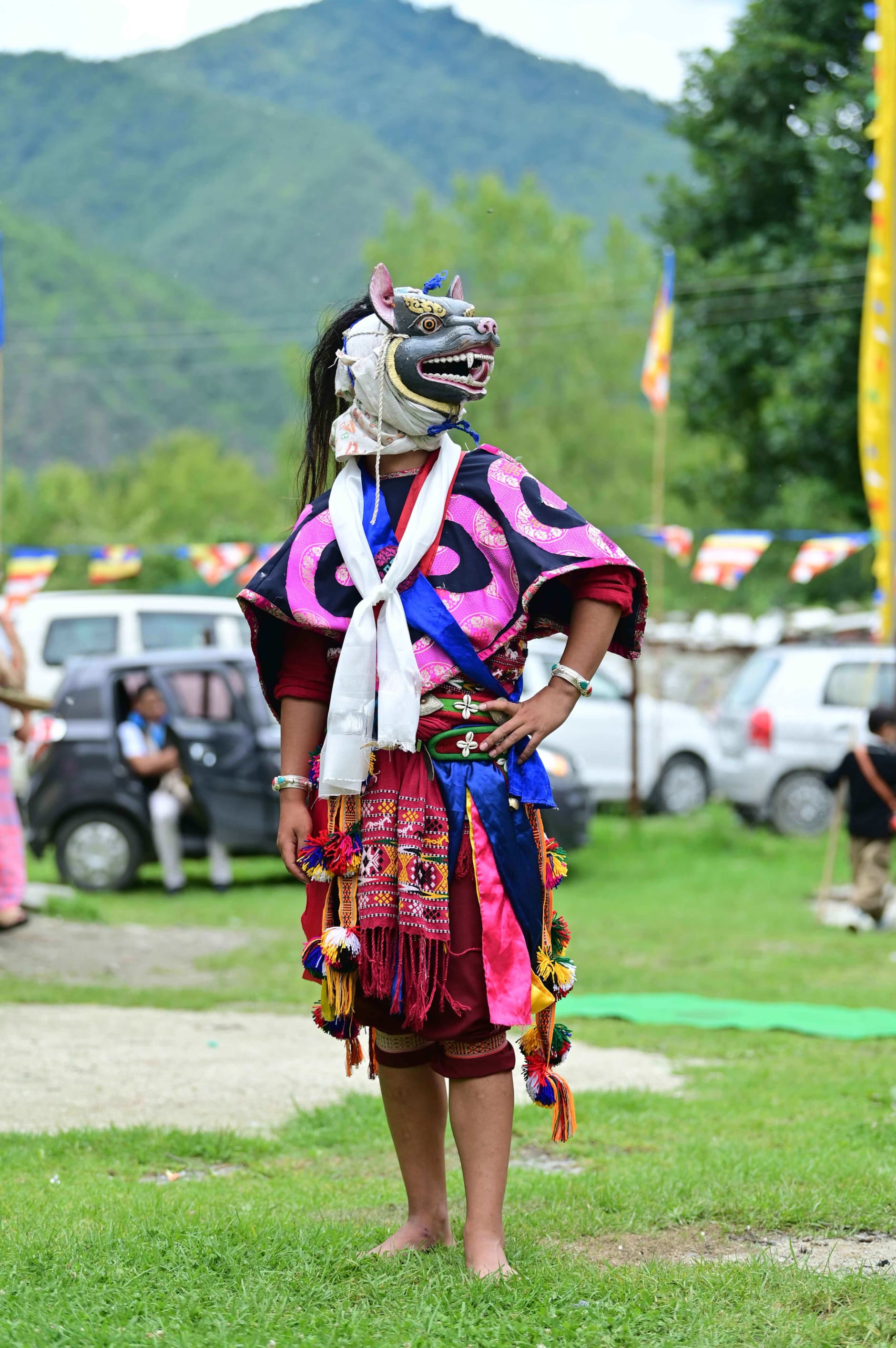 A masked dancer of Bardo Cham in Shergaon, Arunachal, in colourful, traditional attire.