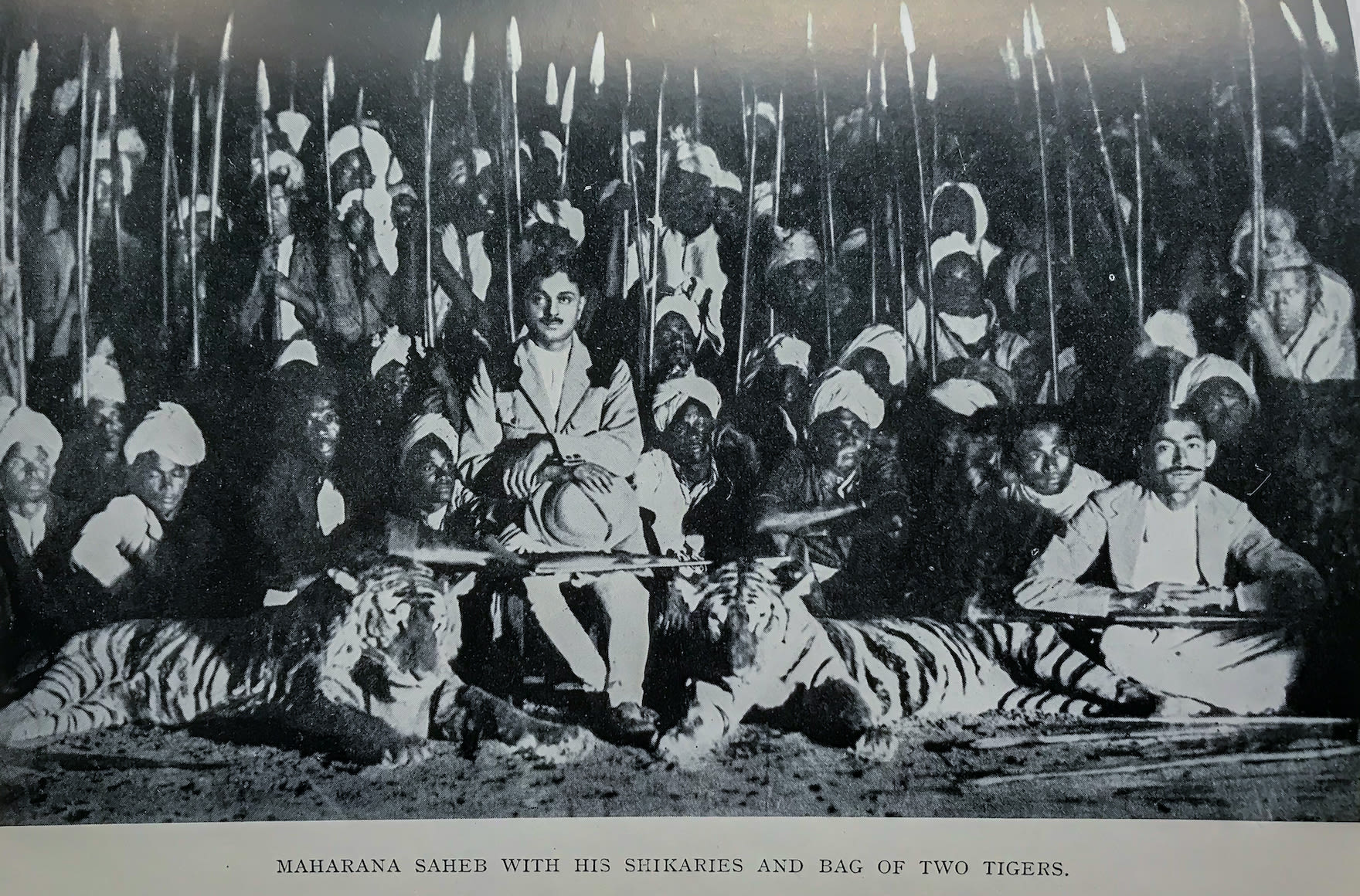 Historic photo of Maharana Vijayadevji of Dharampur with tigers trophies