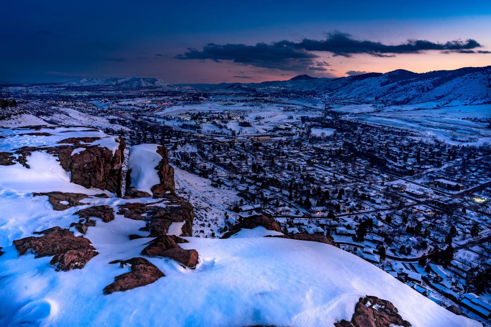 Golden Lights Up First — Golden, Colorado. Dusk settling over the valley from the top of South Table Mountain, with Golden lighting up first and Denver…