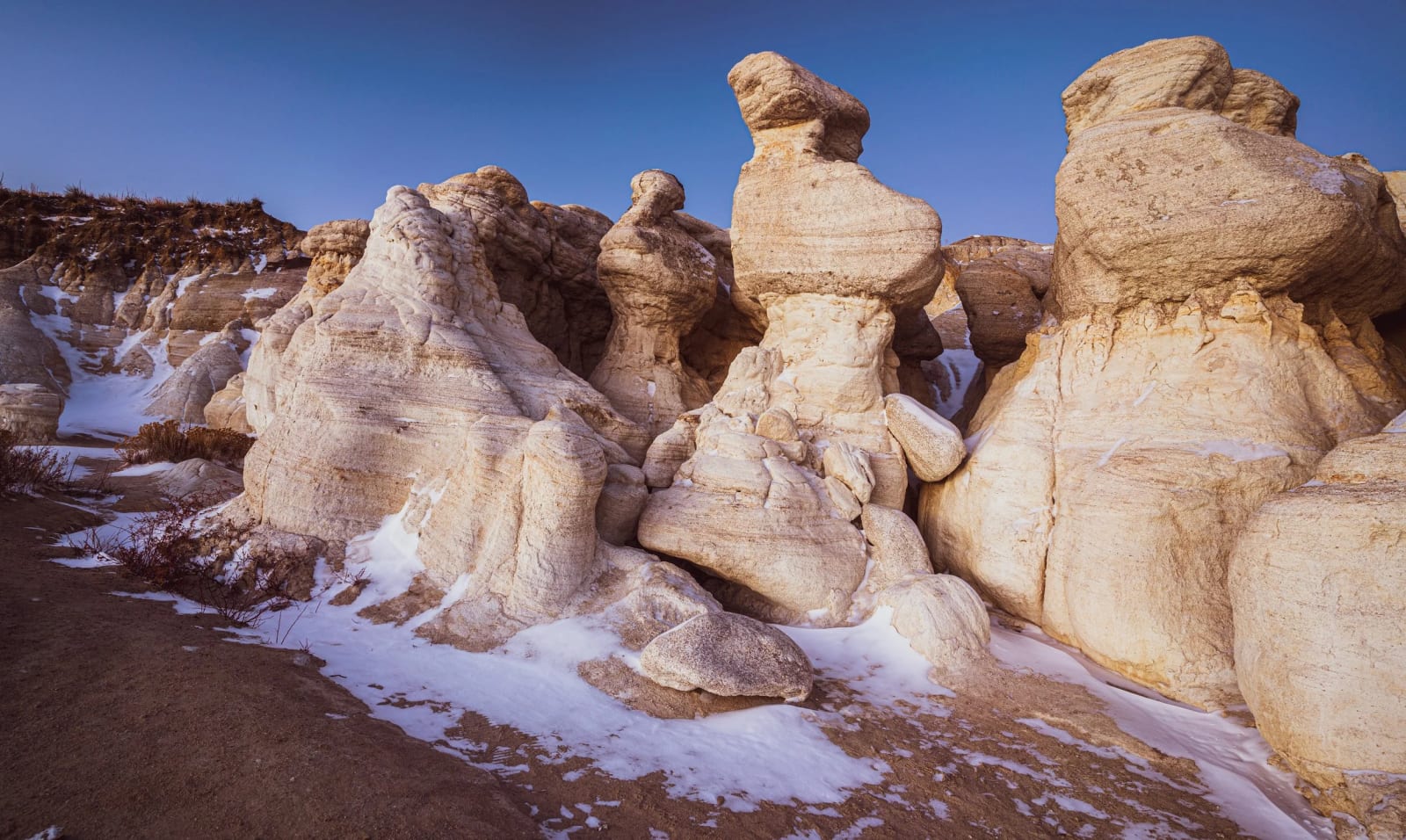 After the Squall — Paint Mines Interpretive Park, Calhan. A dusting of snow settling into the white clay at the Paint Mines near Calhan, Colorado after a…
