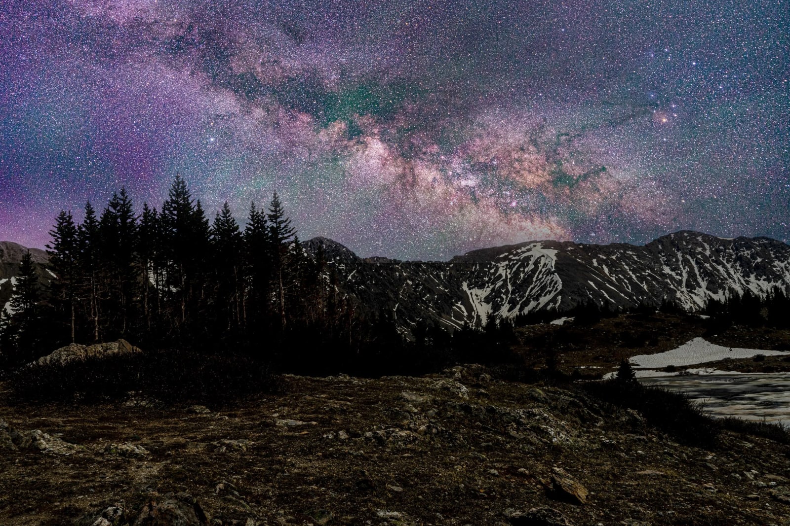 The Core Over the Divide — Loveland Pass, Colorado. The Milky Way core rising over the Continental Divide from Loveland Pass, Colorado, with a wash of green…