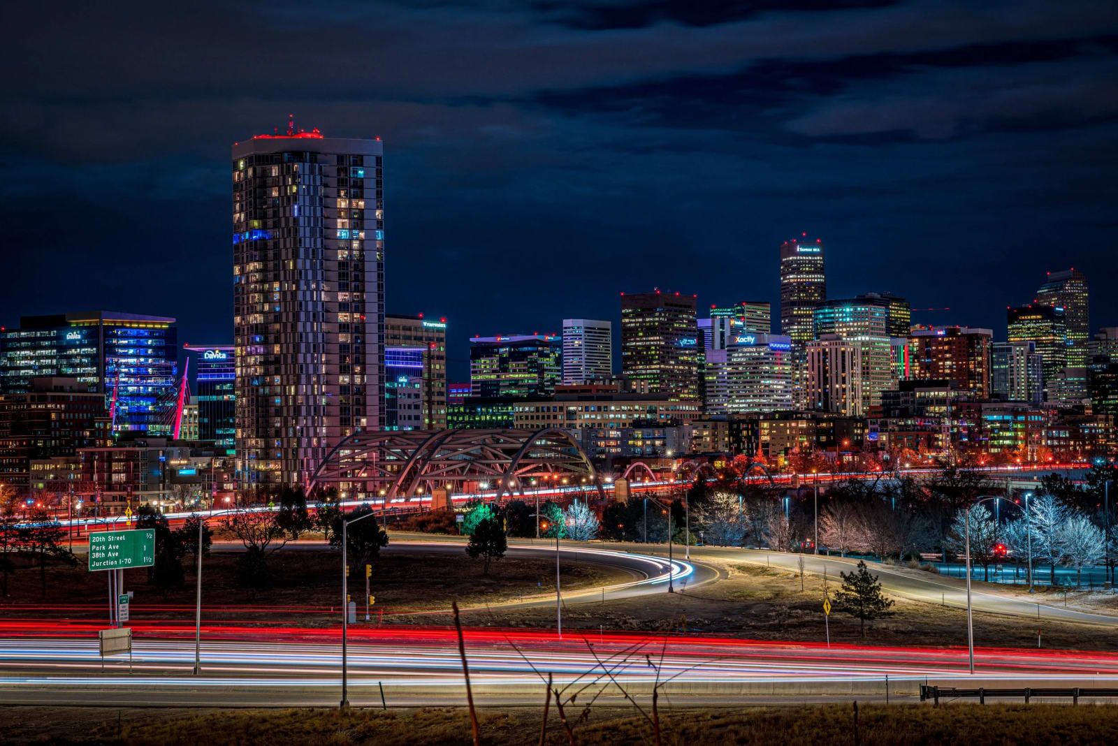 A City That Never Fully Sleeps — Denver, Colorado. Light trails feeding into a Denver skyline that never quite goes dark, shot from the west side on a clear…