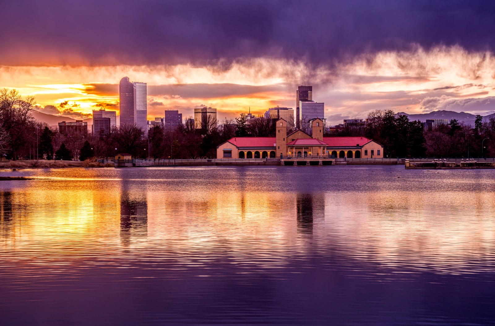 Purple Evening at City Park — City Park, Denver. Sunset over Ferril Lake in Denver's City Park, Colorado, with the downtown skyline and the red-roofed…