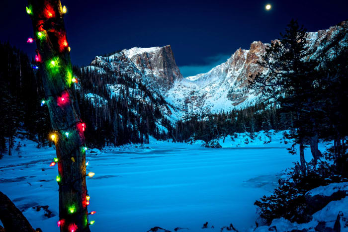 Christmas at Eleven Thousand Feet — Rocky Mountain National Park, Colorado. Somebody strings lights on this little tree at Dream Lake every December and the…