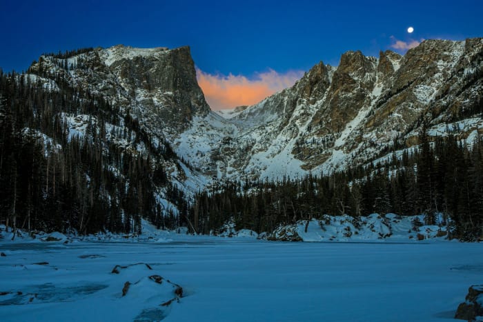 One Cloud Caught Fire — Rocky Mountain National Park, Colorado. One cloud caught fire in the notch above Dream Lake while the moon hung around to watch, the…