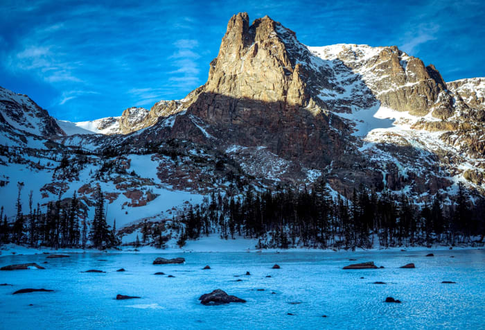 Notchtop From Lake Helene — Rocky Mountain National Park, Colorado. Notchtop Mountain rising straight off a frozen Lake Helene in Rocky Mountain National…