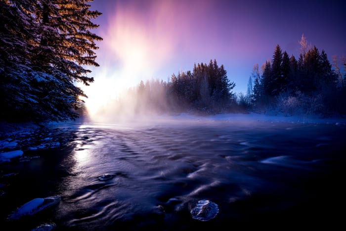 Cold Enough to Make Weather — Silverthorne, Colorado. Steam rising off a Colorado river into the first light of a bitterly cold morning, backlit into a wall…