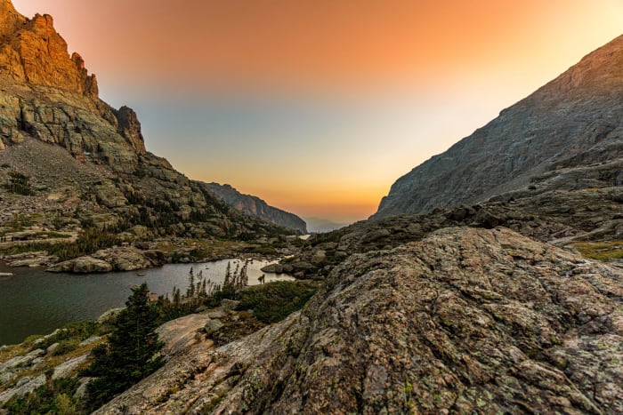 Smoke Makes Strange Light — Rocky Mountain National Park, Colorado. Wildfire haze turning the sky above Rocky Mountain National Park into a gradient nobody…