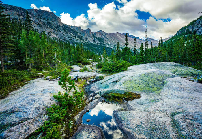 One Puddle's Worth of Sky — Rocky Mountain National Park, Colorado. Glacier-polished granite in Rocky Mountain National Park holding one puddle's worth of…