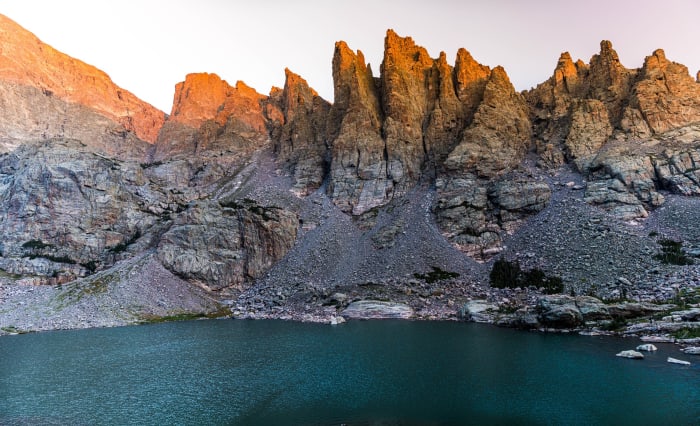First Light on the Sharkstooth — Rocky Mountain National Park, Colorado. First light hitting the Sharkstooth above Sky Pond in Rocky Mountain National Park,…