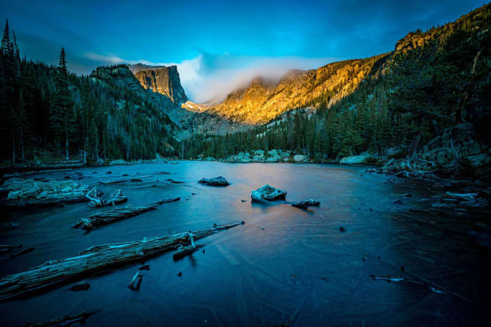 Dream Lake Goes to Glass — Rocky Mountain National Park, Colorado. A long exposure flattening Dream Lake to pure glass while first light works its way…