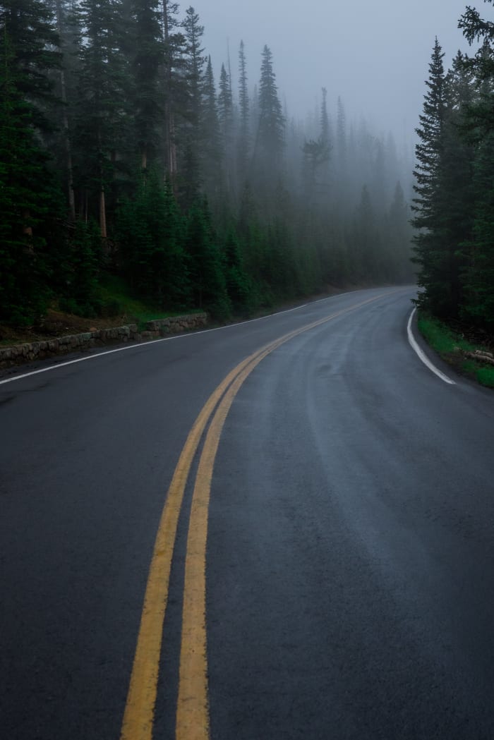 Fog on Trail Ridge Road — Trail Ridge Road, Rocky Mountain National Park. Trail Ridge Road in Rocky Mountain National Park, Colorado, disappearing around a…