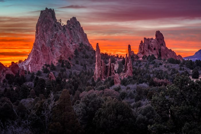 The Garden Catches Fire — Garden of the Gods, Colorado Springs, Colorado. Sunrise over Garden of the Gods in Colorado Springs, Colorado, with the sky…