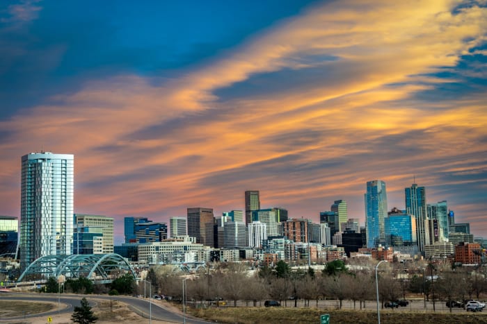 Mile-High Magic — Denver, Colorado. The Denver skyline from the west side of I-25 near the Speer Boulevard exit, with the arched Speer bridges in the…