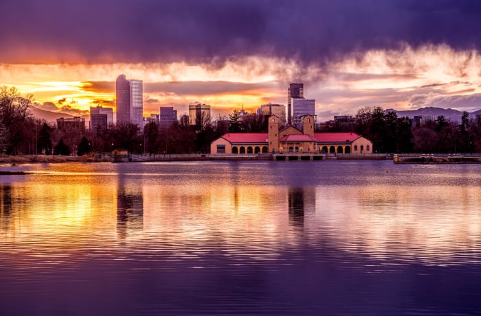 Purple Evening at City Park — City Park, Denver. Sunset over Ferril Lake in Denver's City Park, Colorado, with the downtown skyline and the red-roofed…