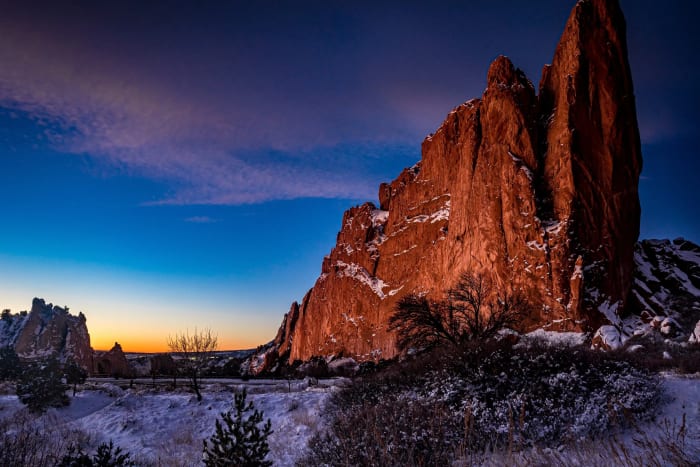 Before the Sun Cleared the Ridge — Garden of the Gods, Colorado Springs, Colorado. The horizon burning orange behind the gateway rocks at Garden of the Gods…
