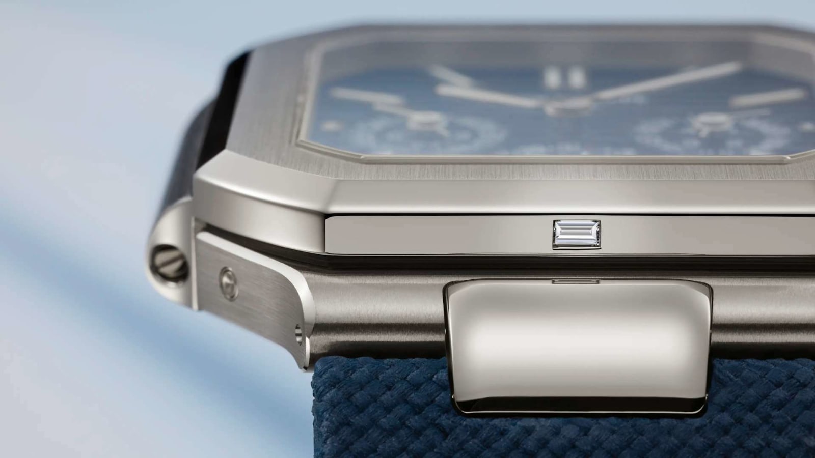 The case side with the baguette-cut diamond at six o'clock