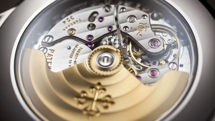 The gold rotor and bridges of the movement, close up