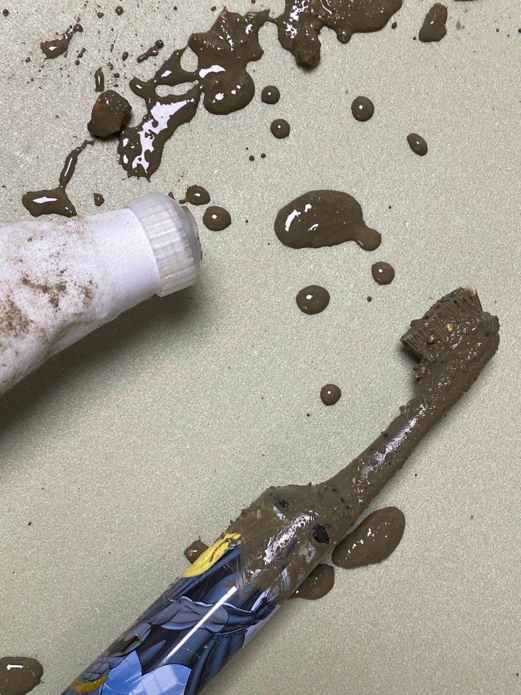 Lucy's final attempt at printing with cement, resulted in broken toothbrush
