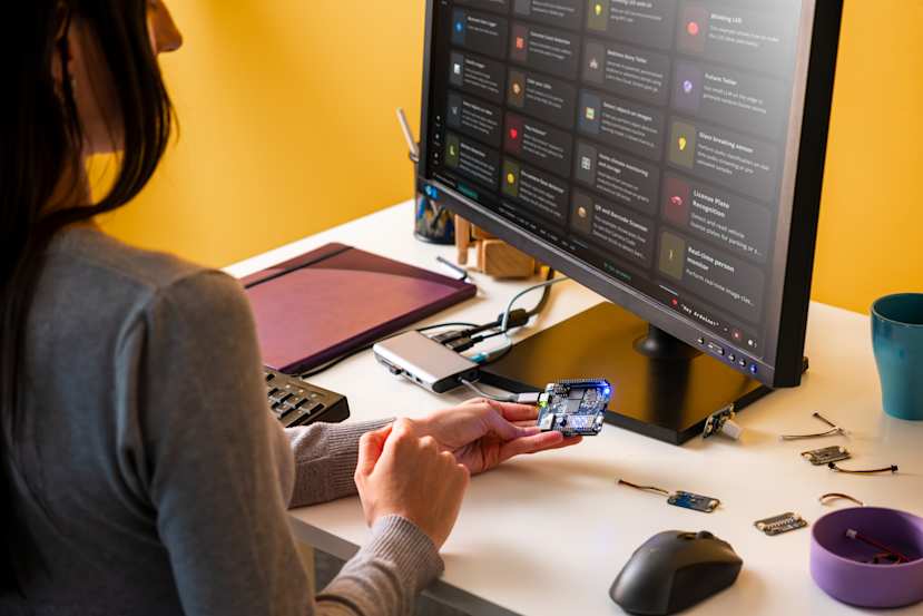 Arduino UNO Q board with Arduino App Lab interface on screen.